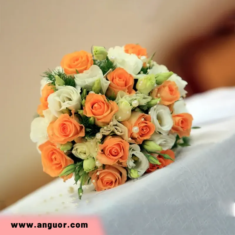 دسته گل عروس با رز نارنجی و لیسیانتوس سفید